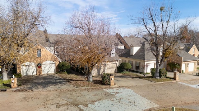 607 Aberdeen Rd, Edmond, OK 73025 - view of front facade with driveway, a garage, and a residential view