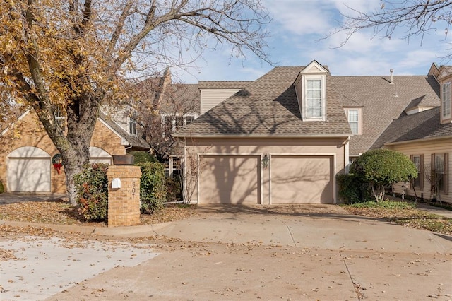 607 Aberdeen Rd, Edmond, OK 73025 - traditional-style home featuring driveway, a shingled roof, and an attached garage