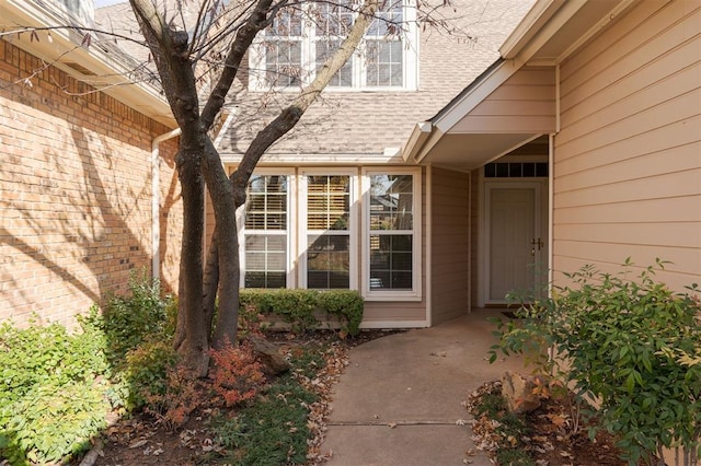 607 Aberdeen Rd, Edmond, OK 73025 - view of exterior entry featuring brick siding