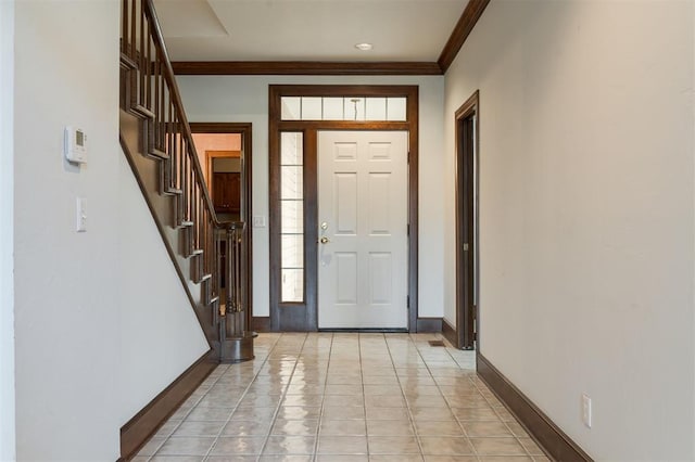 607 Aberdeen Rd, Edmond, OK 73025 - entrance foyer featuring baseboards, ornamental molding, stairs, and light tile patterned flooring