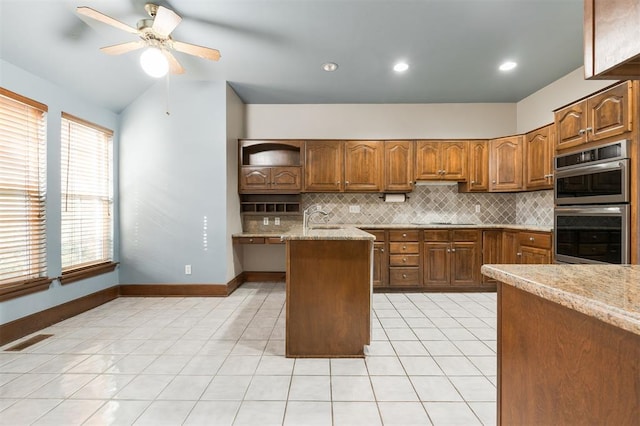 607 Aberdeen Rd, Edmond, OK 73025 - kitchen with open shelves, double oven, tasteful backsplash, black electric stovetop, and lofted ceiling