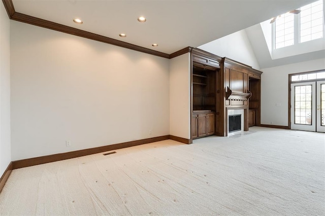 607 Aberdeen Rd, Edmond, OK 73025 - unfurnished living room with baseboards, recessed lighting, crown molding, a fireplace, and light carpet