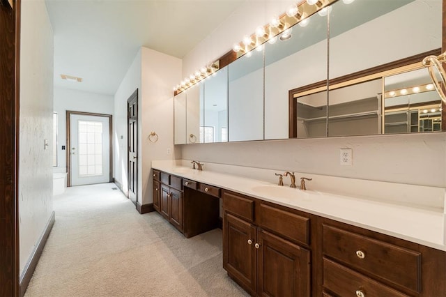 607 Aberdeen Rd, Edmond, OK 73025 - bathroom with double vanity and baseboards