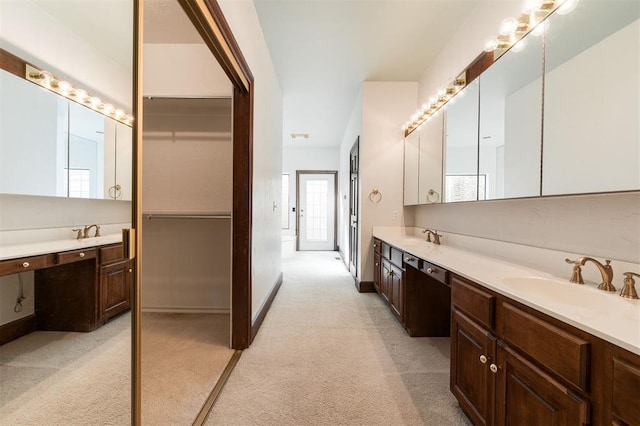 607 Aberdeen Rd, Edmond, OK 73025 - full bathroom with double vanity, baseboards, and carpet flooring