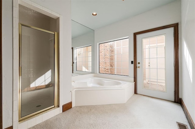 607 Aberdeen Rd, Edmond, OK 73025 - bathroom featuring a shower stall, a garden tub, and carpet floors