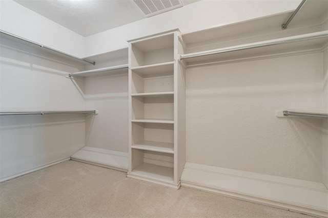 607 Aberdeen Rd, Edmond, OK 73025 - walk in closet featuring carpet