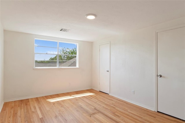 1121 NW 105th St, Oklahoma City, OK 73114 - spare room featuring light wood-style flooring and baseboards