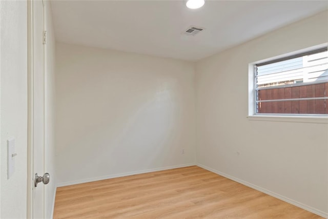 1121 NW 105th St, Oklahoma City, OK 73114 - empty room with wood finished floors and baseboards