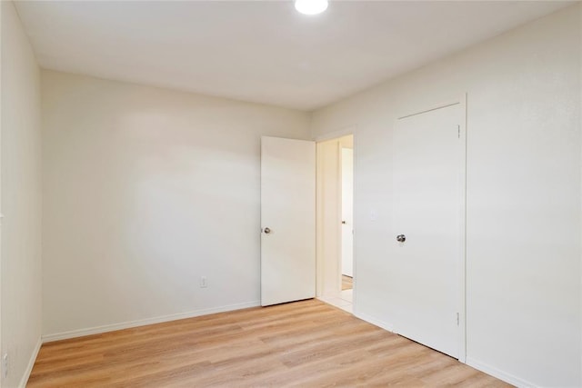 1121 NW 105th St, Oklahoma City, OK 73114 - unfurnished bedroom featuring light wood-style floors and baseboards