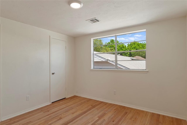1121 NW 105th St, Oklahoma City, OK 73114 - spare room with light wood finished floors and baseboards
