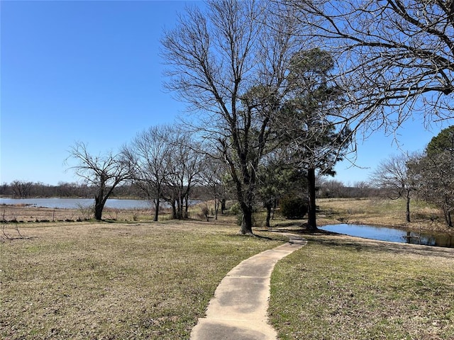 3001 Hardy Spgs, Mcalester, OK 74501 - view of green lawn featuring a water view