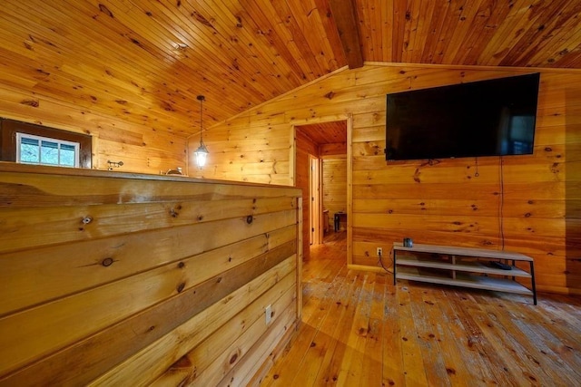 657 Canoe Rd, Broken Bow, OK 74728 - hallway featuring wooden walls, vaulted ceiling, wooden ceiling, and wood-type flooring