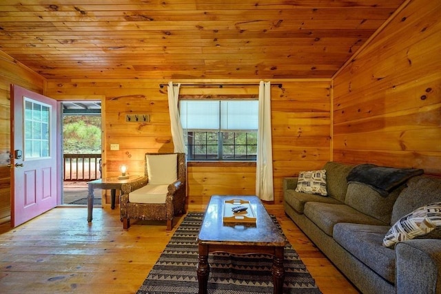 657 Canoe Rd, Broken Bow, OK 74728 - living room featuring lofted ceiling, wooden ceiling, wooden walls, and hardwood / wood-style flooring
