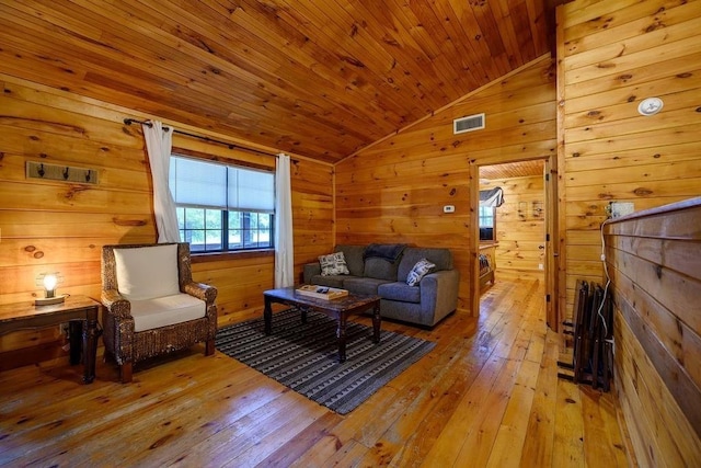 657 Canoe Rd, Broken Bow, OK 74728 - living area featuring vaulted ceiling, hardwood / wood-style flooring, wooden walls, and wood ceiling