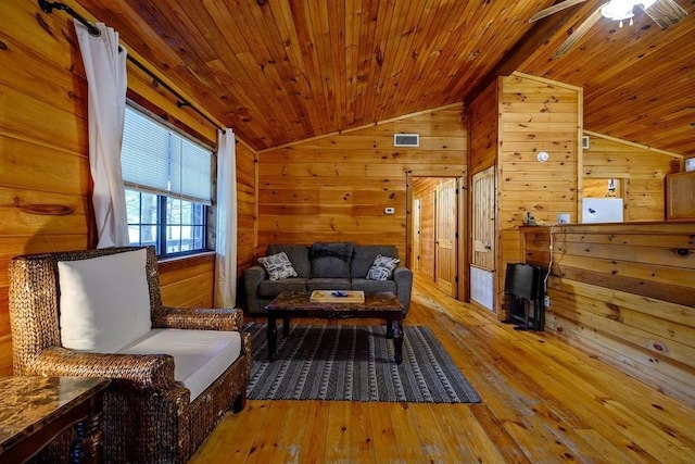 657 Canoe Rd, Broken Bow, OK 74728 - living room featuring vaulted ceiling, wood ceiling, wooden walls, a ceiling fan, and wood-type flooring