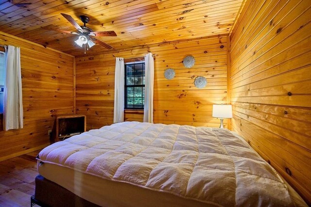 657 Canoe Rd, Broken Bow, OK 74728 - bedroom featuring wood ceiling, wooden walls, and wood finished floors