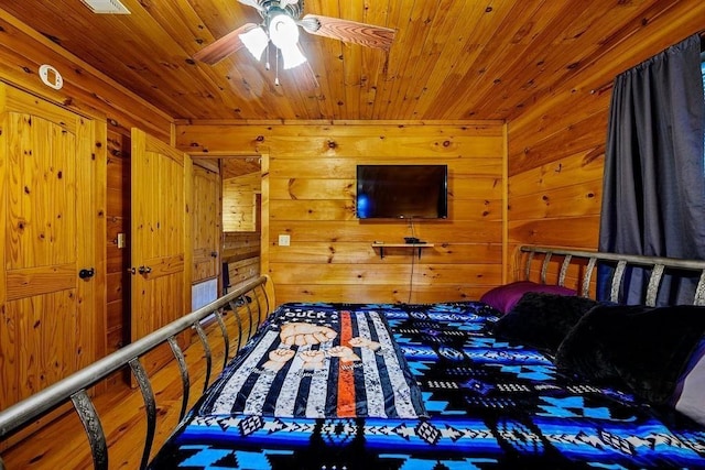 657 Canoe Rd, Broken Bow, OK 74728 - bedroom featuring wood walls and wood ceiling