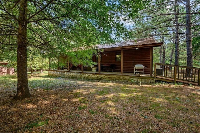 657 Canoe Rd, Broken Bow, OK 74728 - view of yard featuring a deck