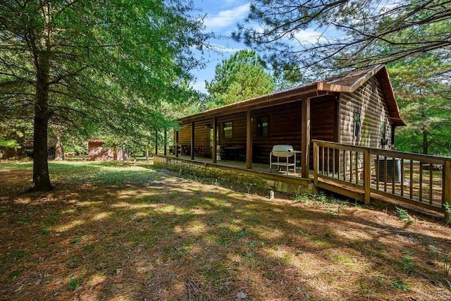 657 Canoe Rd, Broken Bow, OK 74728 - view of yard featuring a deck and central air condition unit