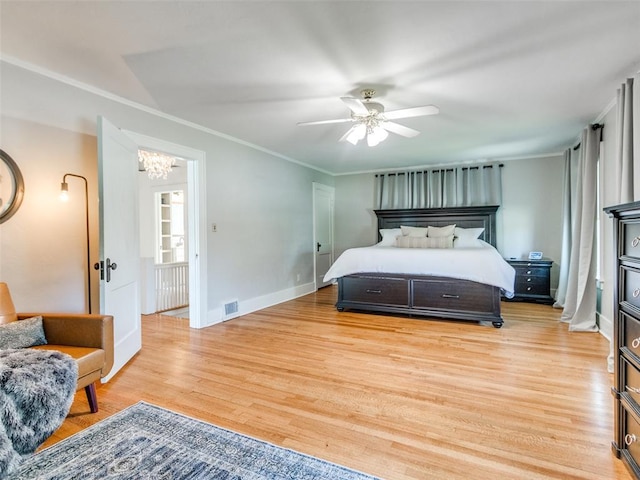 1218 NW 21st St, Oklahoma City, OK 73106 - bedroom with a chandelier, light wood-style floors, crown molding, baseboards, and a ceiling fan