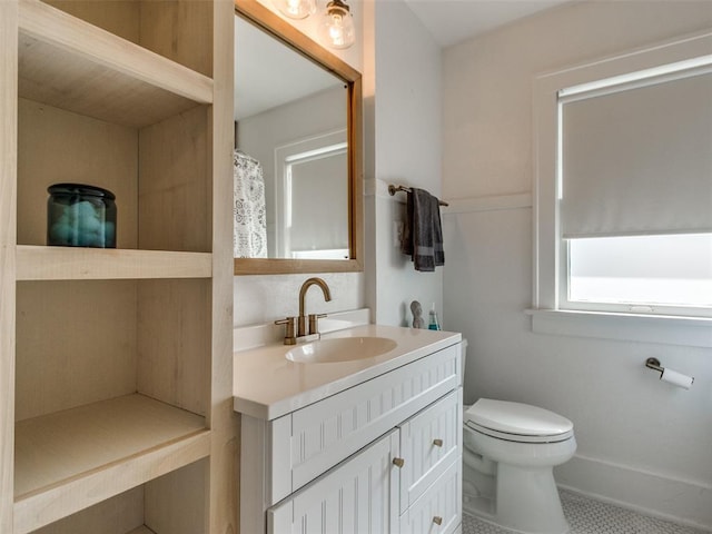1218 NW 21st St, Oklahoma City, OK 73106 - bathroom featuring vanity, toilet, and tile patterned flooring