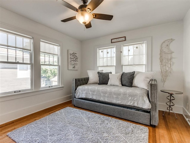 1218 NW 21st St, Oklahoma City, OK 73106 - bedroom featuring multiple windows, baseboards, and light wood-style flooring