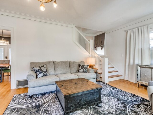 1218 NW 21st St, Oklahoma City, OK 73106 - living room featuring stairway, crown molding, and wood finished floors