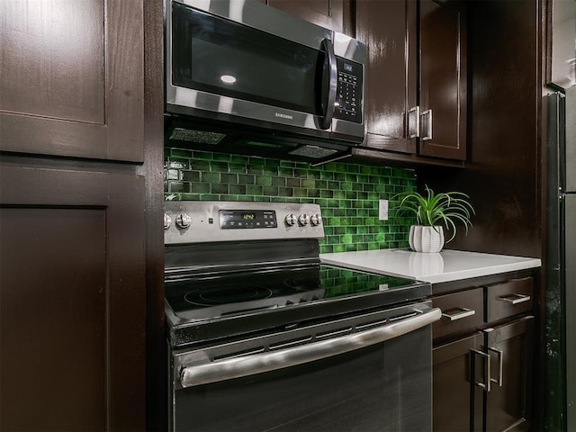 931 NW 7th St Unit 104, Oklahoma City, OK 73106 - kitchen with stainless steel appliances, dark brown cabinets, tasteful backsplash, and light countertops