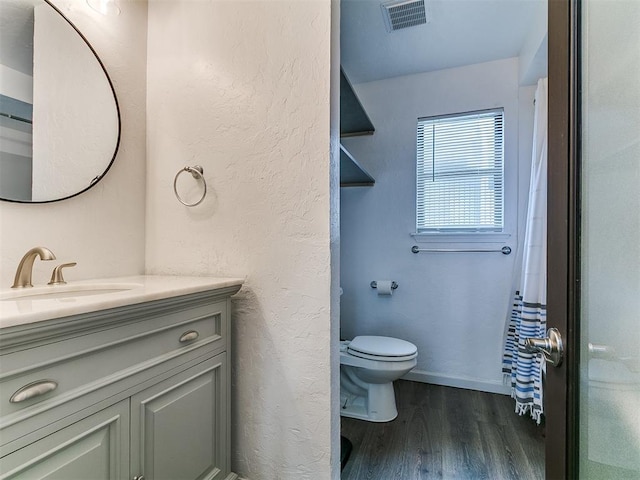 931 NW 7th St Unit 104, Oklahoma City, OK 73106 - bathroom featuring wood finished floors and vanity