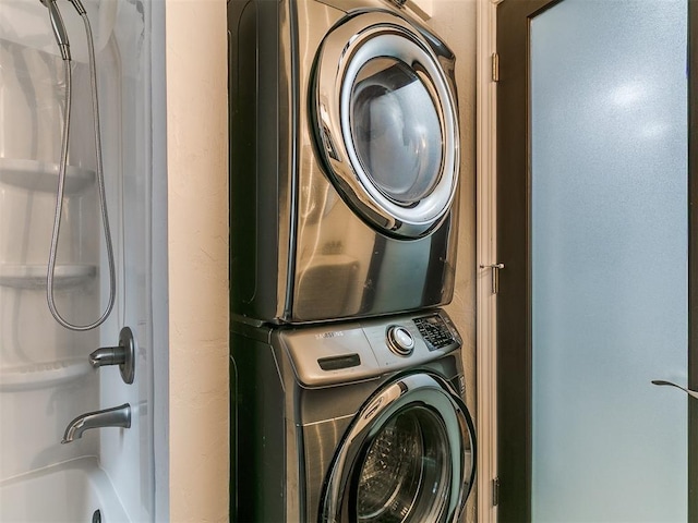 931 NW 7th St Unit 104, Oklahoma City, OK 73106 - washroom featuring stacked washing machine and dryer