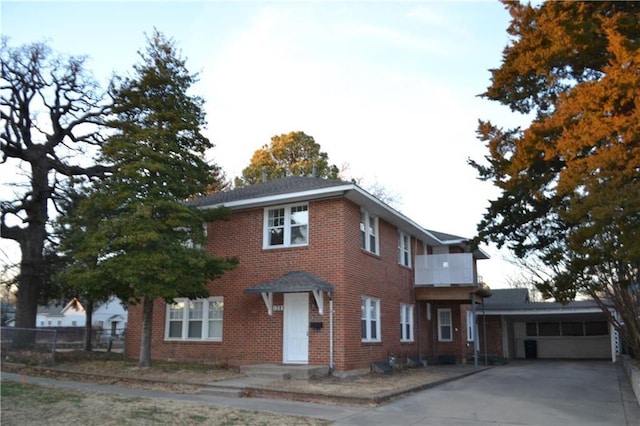 128 W Ridgewood St, Shawnee, OK 74801 - view of front facade featuring brick siding and concrete driveway