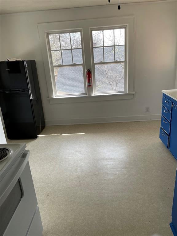 128 W Ridgewood St, Shawnee, OK 74801 - unfurnished dining area featuring plenty of natural light and baseboards
