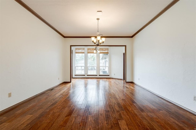 2613 NW 159th St, Edmond, OK 73013 - spare room with a chandelier, hardwood / wood-style flooring, crown molding, and baseboards