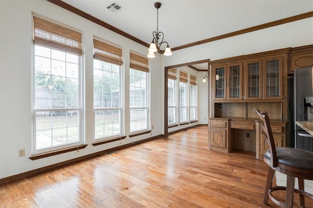 2613 NW 159th St, Edmond, OK 73013 - unfurnished office with crown molding, light wood-style floors, a chandelier, and baseboards