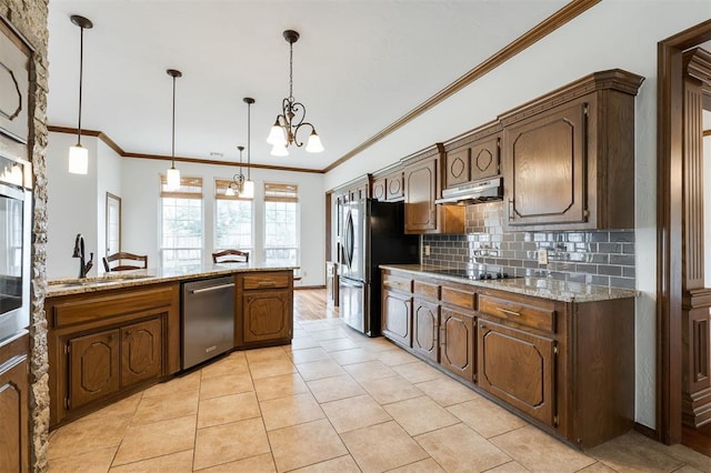 2613 NW 159th St, Edmond, OK 73013 - kitchen featuring stainless steel appliances, a sink, a chandelier, light tile patterned flooring, and decorative backsplash