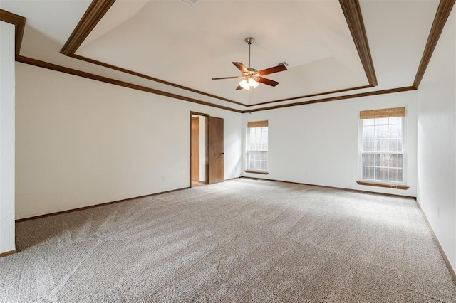 2613 NW 159th St, Edmond, OK 73013 - empty room featuring a tray ceiling, carpet floors, ceiling fan, crown molding, and baseboards