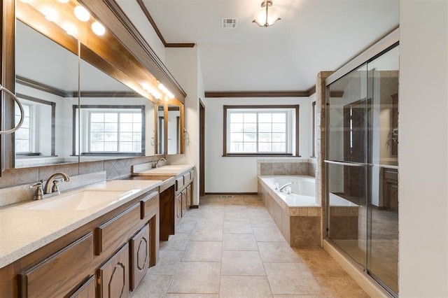 2613 NW 159th St, Edmond, OK 73013 - full bath with crown molding, healthy amount of natural light, double vanity, a garden tub, and a stall shower