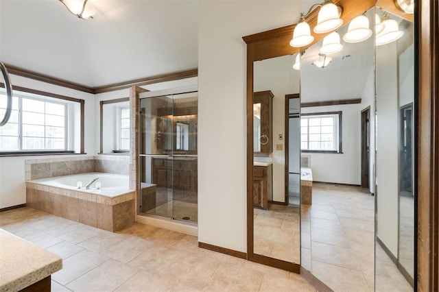 2613 NW 159th St, Edmond, OK 73013 - full bathroom with vanity, tile patterned floors, a bath, a stall shower, and crown molding