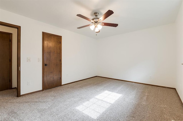 2613 NW 159th St, Edmond, OK 73013 - spare room featuring carpet flooring, a ceiling fan, and baseboards