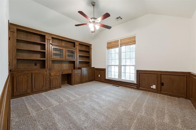 2613 NW 159th St, Edmond, OK 73013 - unfurnished office featuring lofted ceiling, a ceiling fan, built in desk, wainscoting, and carpet floors