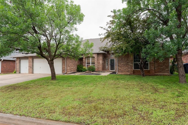 2613 NW 159th St, Edmond, OK 73013 - view of front facade featuring driveway, a front yard, brick siding, and an attached garage