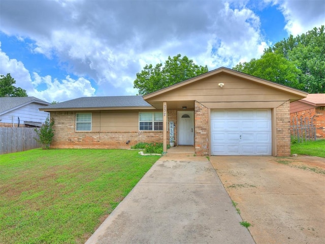 332 Crest Ln, Noble, OK 73068 - ranch-style house with brick siding, concrete driveway, and an attached garage