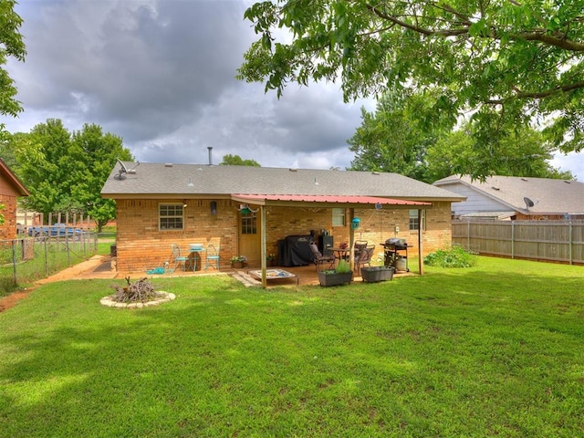 332 Crest Ln, Noble, OK 73068 - back of house featuring brick siding, a patio area, and a fenced backyard