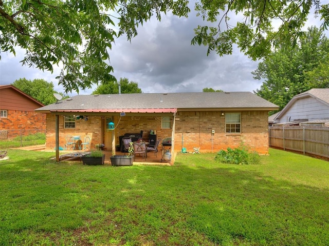 332 Crest Ln, Noble, OK 73068 - rear view of house featuring brick siding, a patio area, and a fenced backyard