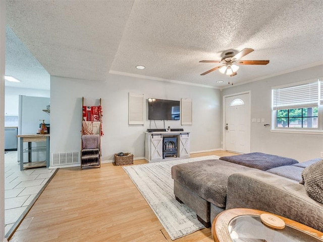 332 Crest Ln, Noble, OK 73068 - living room featuring a textured ceiling, light wood finished floors, ceiling fan, ornamental molding, and recessed lighting