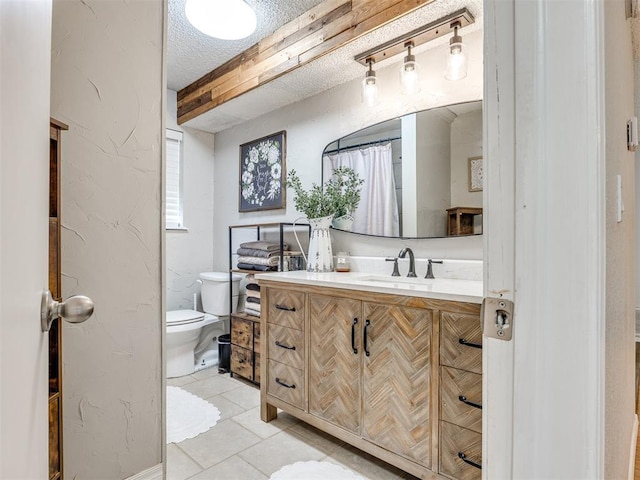 332 Crest Ln, Noble, OK 73068 - bathroom featuring a textured ceiling, vanity, tile patterned flooring, and a textured wall