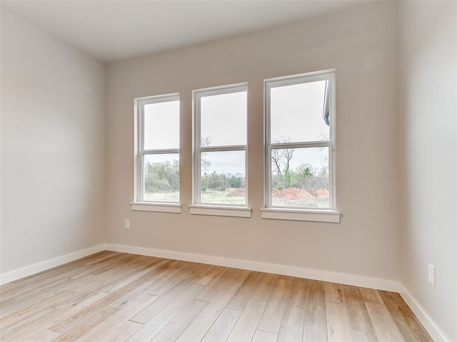 12825 Painted Sky, Edmond, OK 73007 - empty room with light wood-style floors and baseboards