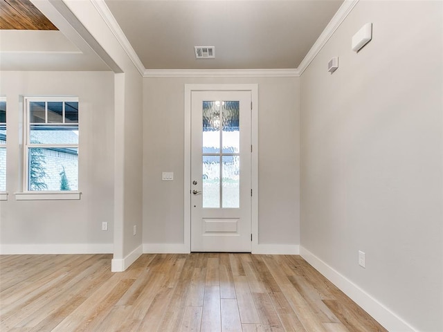 12825 Painted Sky, Edmond, OK 73007 - entryway with light wood-type flooring, baseboards, and crown molding