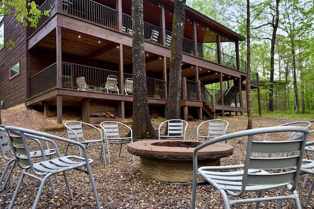 250 Almond Ln, Broken Bow, OK 74728 - view of patio / terrace with stairway, an outdoor fire pit, and a deck