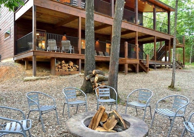 250 Almond Ln, Broken Bow, OK 74728 - view of patio / terrace featuring an outdoor fire pit and stairway